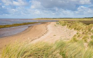 Hightown,Beach,Backed,By,Sand,Dunes,Leading,To,The,Top